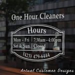 Storefront open hours decal with business name, phone number, and website