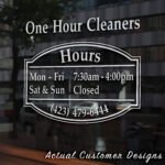 Storefront open hours decal with business name, phone number, and website